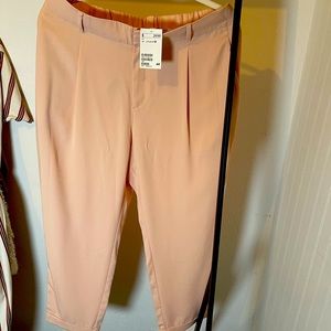 Light weight casual pale pink pants. Perfect for the office or a night out.